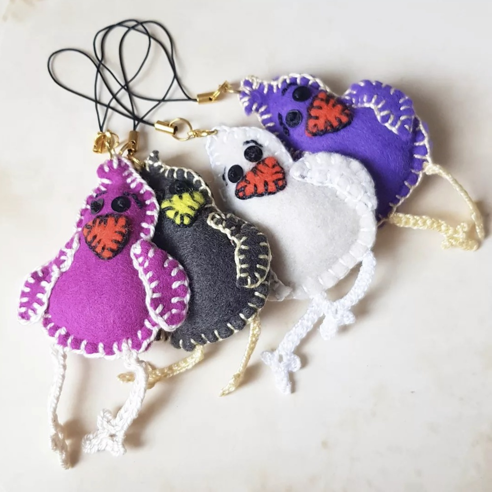 "Carry a touch of whimsy with CocoFlower's Felt Bird Keychains Plush."