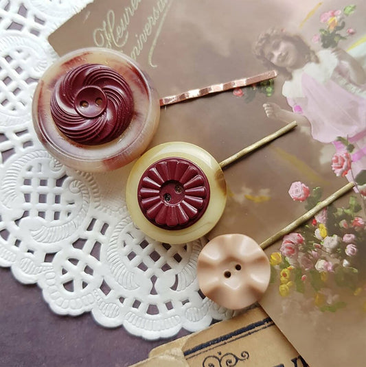 "Upgrade your hair game with our Button Bobby Pins! These vintage-inspired accessories are perfect for adding a nostalgic touch to any hairstyle."