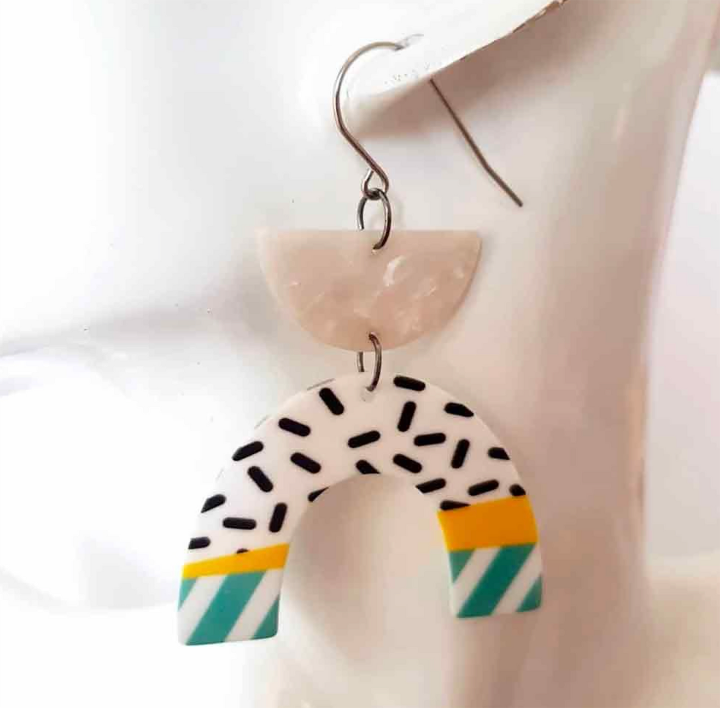 "Set the Trend: Confetti Arch Earrings Radiating with Contemporary Charm"