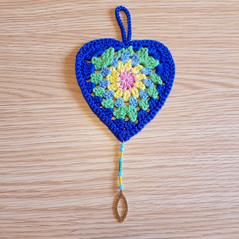 "Infuse your living space with warmth and charm using our Blue Boho Heart Crochet Décor, lovingly made from soft cotton in a granny-style crochet pattern."