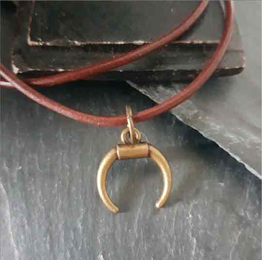 Nature's Spirit: Bronze Horn Pendant with Leather Cord- C o c o F l o w e r