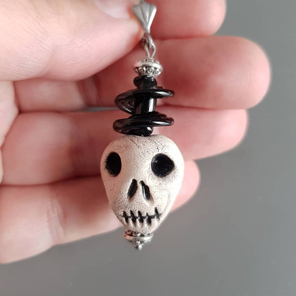 One single artisan 3d ceramic skull face earring