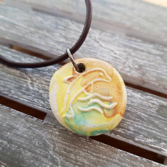 Ride the Wave with our Yellow Dolphin Pendant Necklace!