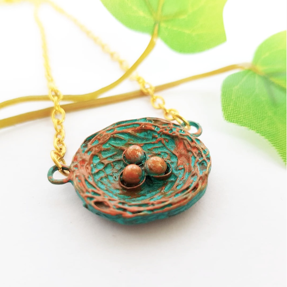 "Birdnest Pendant - Add a touch of whimsy to your look with our Bird's Nest Statement Necklace. 🕊️✨"