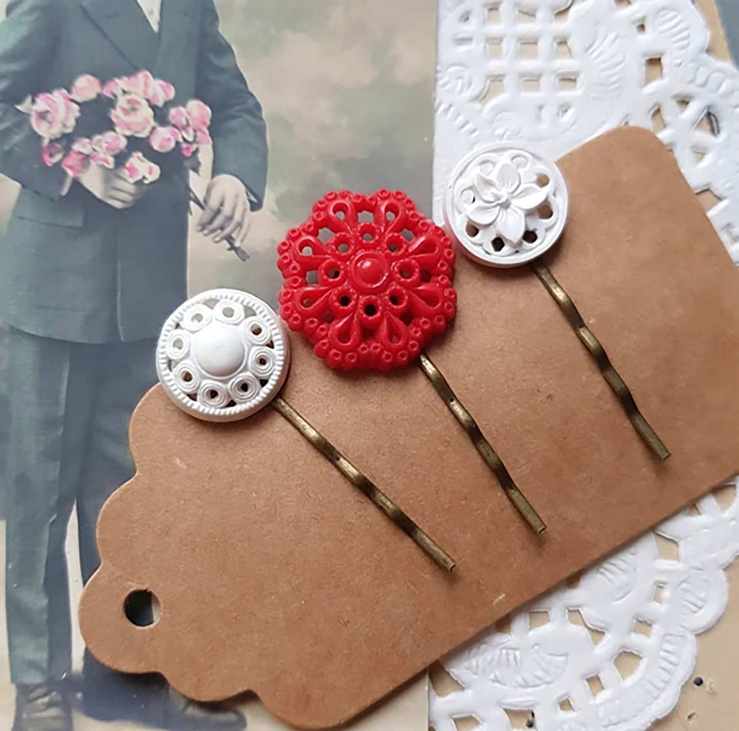 "Accessorize in style with our Button Bobby Pins, crafted from a curated selection of vintage buttons for a one-of-a-kind finish."